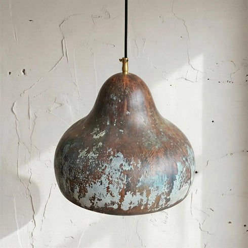 Enhance your living space with an Art of handmade copper pear light