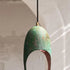Bring a unique artistic statement with an Art of handmade single verdigris pendant