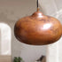 Transform your space with a stunning Art of handmade aged copper pendant trio.