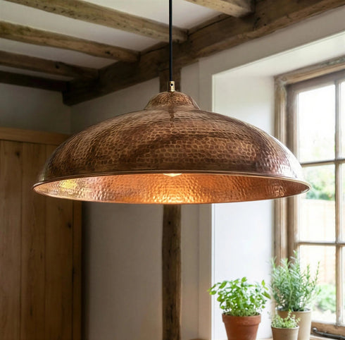 Bring timeless elegance to your home with an Art of handmade flared copper pendant.