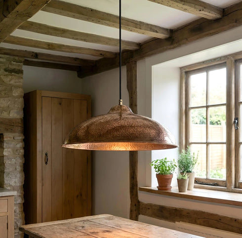 Bring timeless elegance to your home with an Art of handmade flared copper pendant.