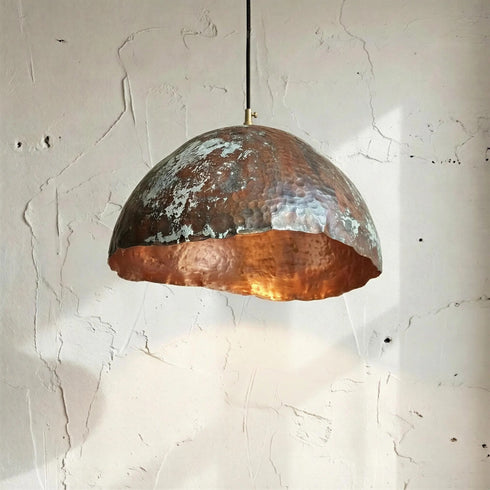 Add a bold artistic touch with an Art of handmade wavy copper pendant