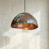 Add a bold artistic touch with an Art of handmade wavy copper pendant
