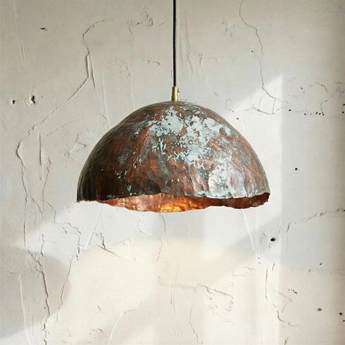 Add a bold artistic touch with an Art of handmade wavy copper pendant