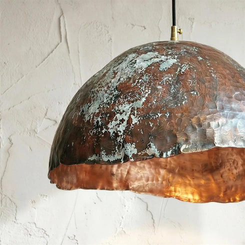 Add a bold artistic touch with an Art of handmade wavy copper pendant