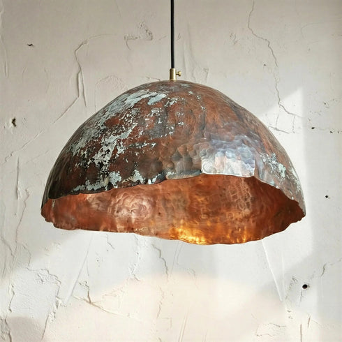 Add a bold artistic touch with an Art of handmade wavy copper pendant