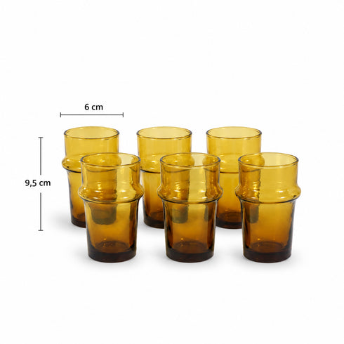 Warm up your drinkware collection with an Art of handmade amber Moroccan tea glass.