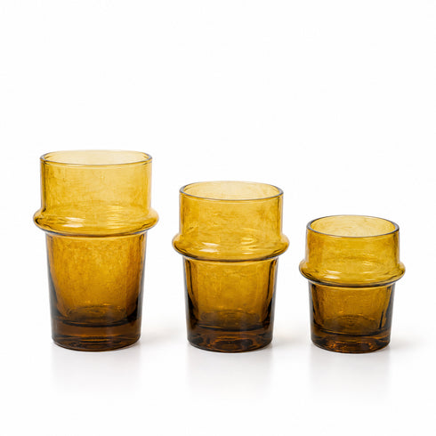 Warm up your drinkware collection with an Art of handmade amber Moroccan tea glass.