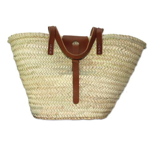 Handwoven Moroccan straw basket with brown leather handles and front closure
