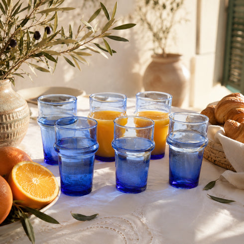 Dress a vibrant tablescape with our Art of handmade blue Moroccan Beldi glasses.