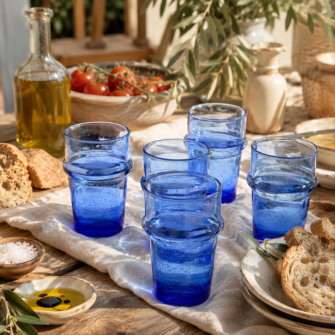 Dress a vibrant tablescape with our Art of handmade blue Moroccan Beldi glasses.