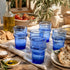 Dress a vibrant tablescape with our Art of handmade blue Moroccan Beldi glasses.