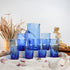 Dress a vibrant tablescape with our Art of handmade blue Moroccan Beldi glasses.