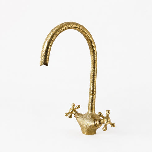 Complete your custom vanity with an Art of handmade brass arched faucet.