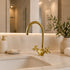 Complete your custom vanity with an Art of handmade brass arched faucet.