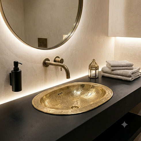 Elevate your bathroom countertop with an Art of handmade brass oval engraved sink.
