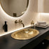 Elevate your bathroom countertop with an Art of handmade brass oval engraved sink.