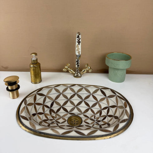 Anchor your luxury bathroom vanity with our Art of handmade brass pattern sink.
