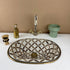 Anchor your luxury bathroom vanity with our Art of handmade brass pattern sink.