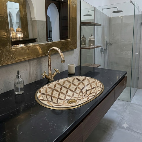 Anchor your luxury bathroom vanity with our Art of handmade brass pattern sink.