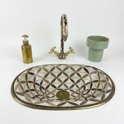 Anchor your luxury bathroom vanity with our Art of handmade brass pattern sink.