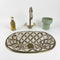 Anchor your luxury bathroom vanity with our Art of handmade brass pattern sink.