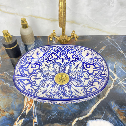 Grace your vanity counter with an Art of handmade ceramic oval floral sink.