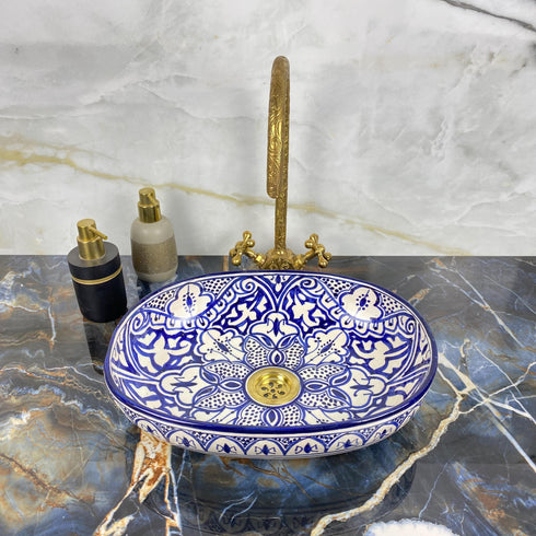 Grace your vanity counter with an Art of handmade ceramic oval floral sink.
