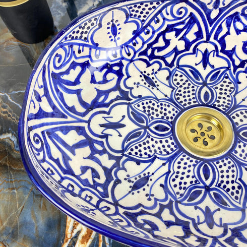 Grace your vanity counter with an Art of handmade ceramic oval floral sink.