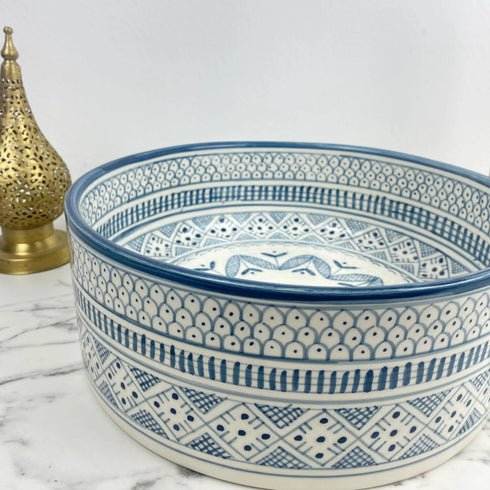 Illuminate your vanity with an Art of handmade ceramic round sink.
