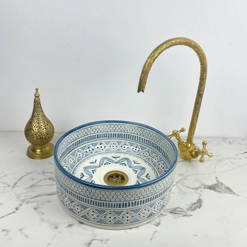 Illuminate your vanity with an Art of handmade ceramic round sink.