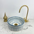 Illuminate your vanity with an Art of handmade ceramic round sink.