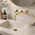 Wall-Mount Bathroom Sink Faucet with 8-Inch Spout – Unlacquered Brass