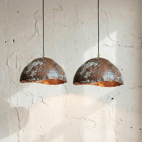 Add artistic elegance to your space with an Art of handmade copper teardrop light.