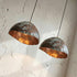 Add artistic elegance to your space with an Art of handmade copper teardrop light.