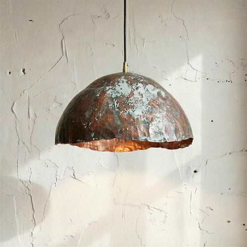 Add artistic elegance to your space with an Art of handmade copper teardrop light.