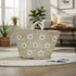 Handwoven Moroccan straw basket with white embroidered flowers