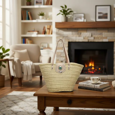 Handwoven Moroccan straw tote bag with natural leather handles and decorative gemstone clasp
