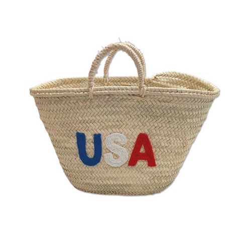 Handwoven straw tote bag with USA embroidered lettering in red, white, and blue