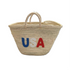 Handwoven straw tote bag with USA embroidered lettering in red, white, and blue