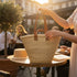 Moroccan straw basket with flat leather handles