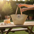 Large handwoven Moroccan straw basket with flat leather handles