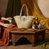 Large handwoven Moroccan straw basket with flat leather handles