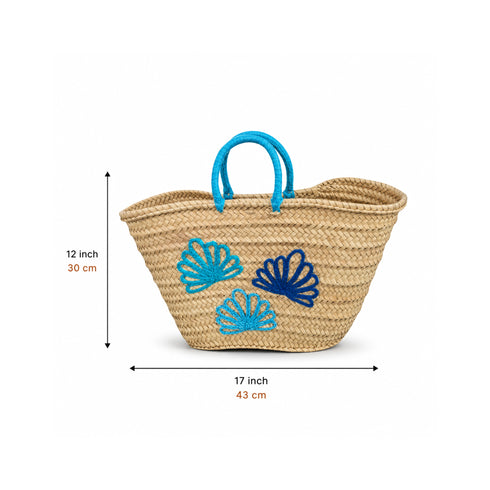 Handwoven Moroccan straw basket with embroidered shell motif