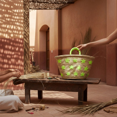 Large handwoven Moroccan straw basket with embroidered stars