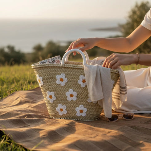 Large handwoven Moroccan straw basket with white embroidered flowers