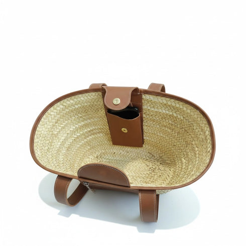 Large handwoven Moroccan straw basket with leather pocket