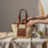 Large handwoven Moroccan straw basket with leather pocket