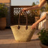 Handwoven Moroccan straw basket with simple leather handles
