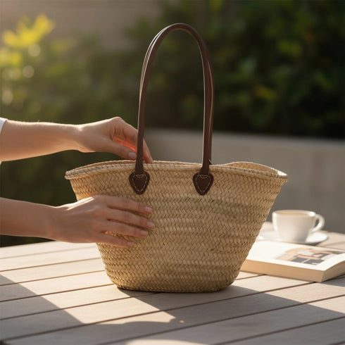 Handwoven Moroccan straw basket with simple leather handles